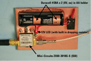 Figure 5. I made my own broadband preamp using a Mini-Circuits model ZX60-3018G-S. It is powered it with two 6V Duracell #28A batteries, which happen to fit in a standard “AA” battery holder. The amplifier covers 20 to 3000 MHz at 20 dB gain and is used to boost the probe signals.