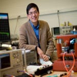 Associate professor of electrical and computer engineering Nian Sun works on the interface of radio-frequency devices and the magnetic field. (Photo: Brooks Canaday / Northeastern University)