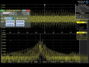 Figure 18 – Received harmonic voltage from the current probe (upper trace) and the FFT of that voltage, showing the resonant peak at 88.4 MHz for the 1m long cable under test.